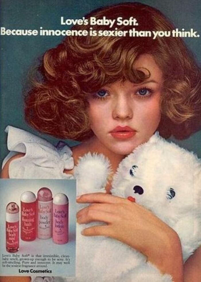 Vintage ad for Love's Baby Soft perfume featuring a young woman with curly hair holding a teddy bear.