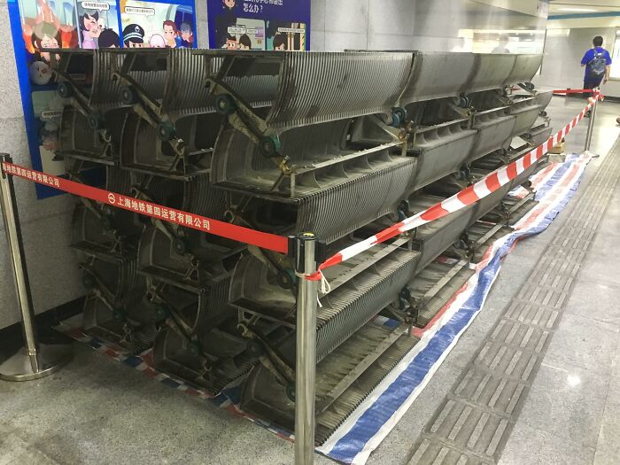 Stacked escalator steps in a subway, showcasing an interesting aspect of urban infrastructure maintenance.