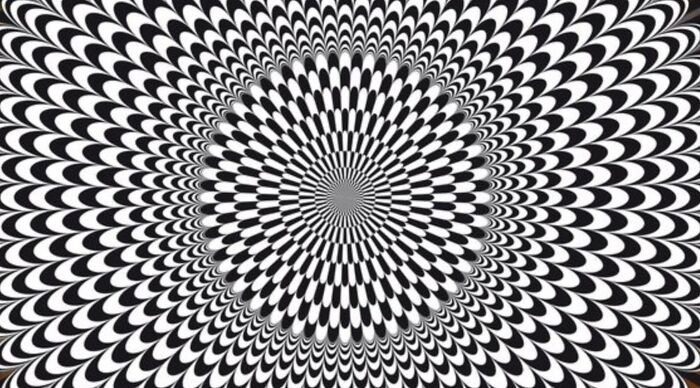 Black and white radial optical illusion with eye-catching pattern effect.