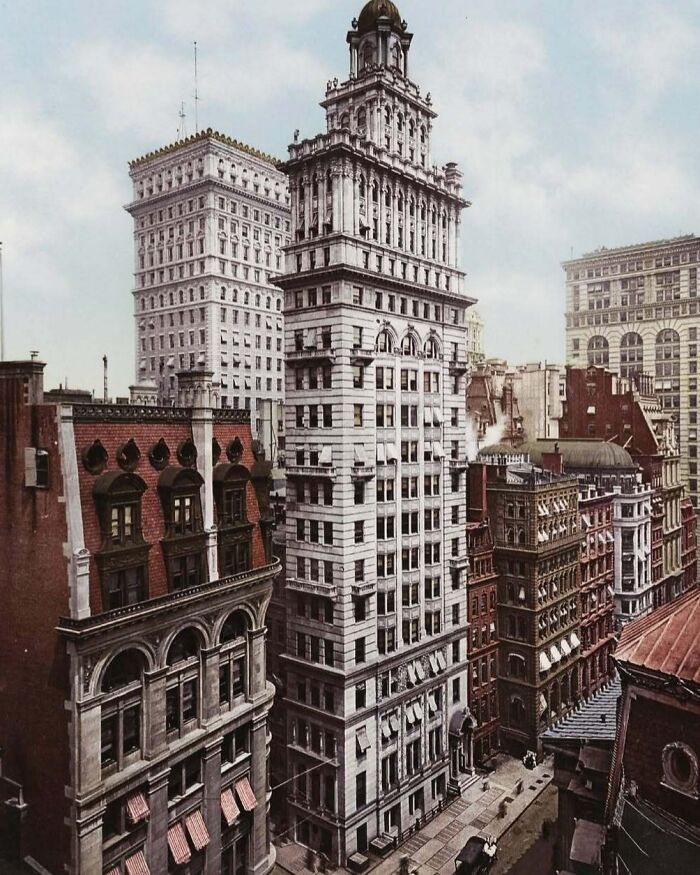 Historic American architecture featuring tall, intricate buildings in an urban setting.