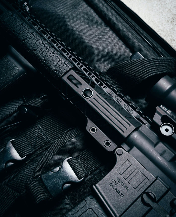 Close-up of a rifle on tactical gear, highlighting safety and life-saving considerations in critical situations.