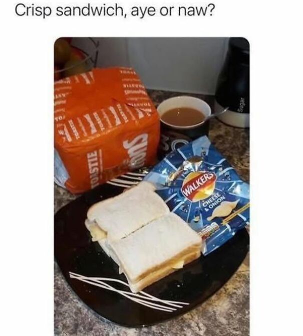 Scottish humor: crisp sandwich on a plate with bread loaf and tea nearby.