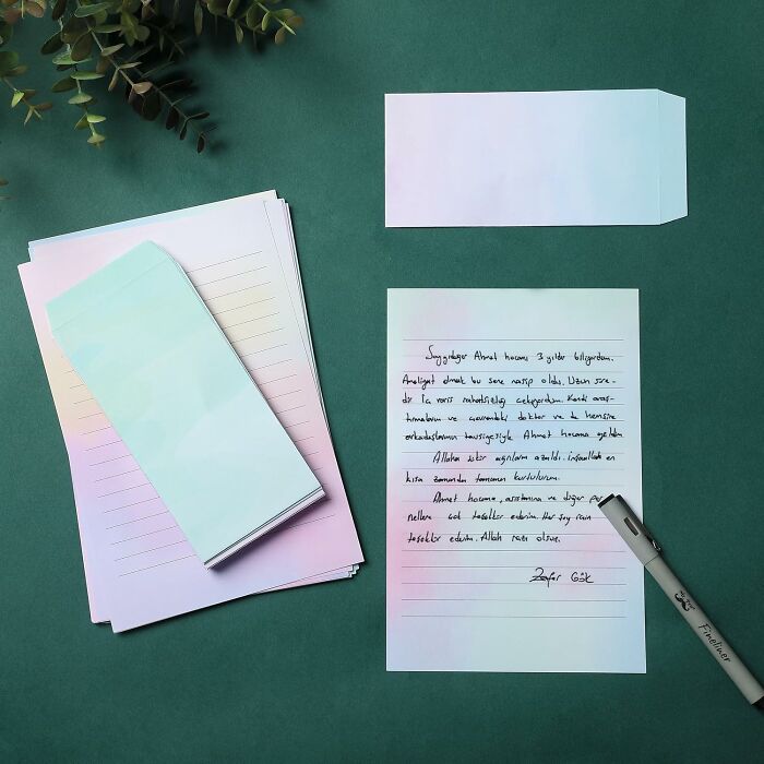 "Handwritten letter on pastel paper, representing a digital detox through analog communication."