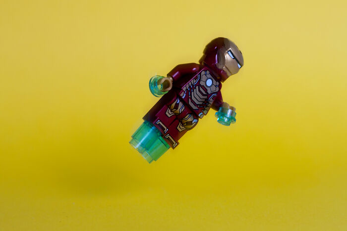 Child playing with colorful toy blocks, potential object for doctors to remove from body.