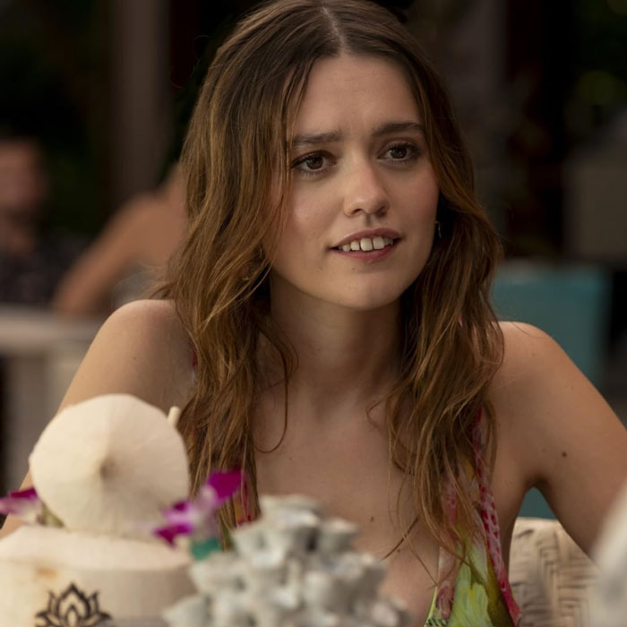 Aimee Lou Wood at a cafe table, responding to comments on her teeth. Aimee Lou Wood at a cafe table, responding to comments on her teeth.