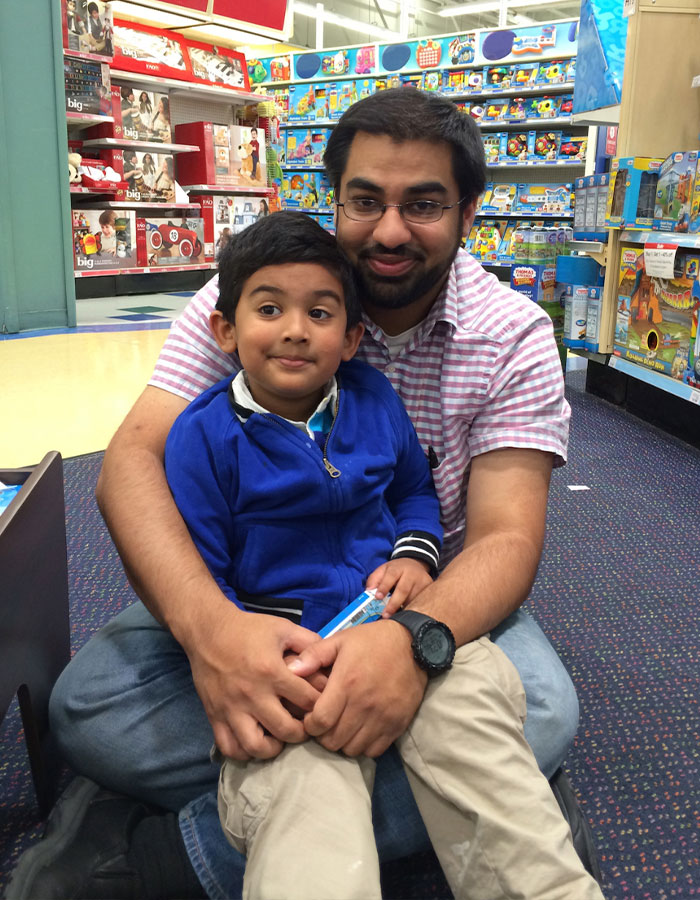 Father and son reunited after boy's disappearance; sitting in a toy store. Father and son reunited after boy's disappearance; sitting in a toy store.