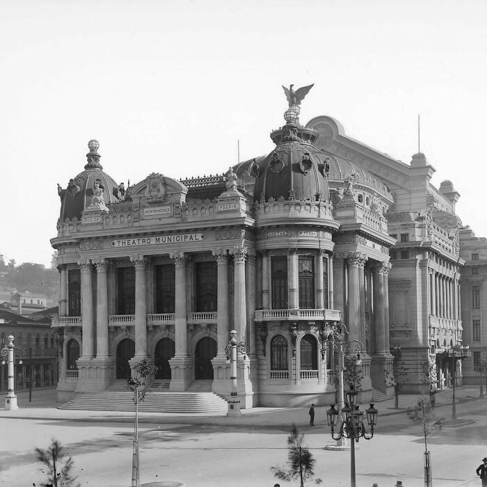 Grand old American architecture with ornate facade and domes, featuring columns and intricate details, titled Teatro Municipal.