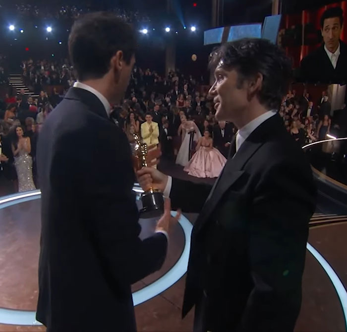 Cillian Murphy looks on as Adrien Brody holds Oscar, making headlines for his expression during the event. Cillian Murphy looks on as Adrien Brody holds Oscar, making headlines for his expression during the event.