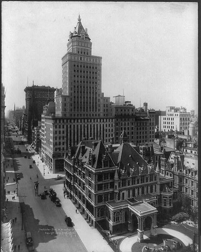 Historic American architecture featuring grand buildings and a busy street, capturing the essence of old urban design.