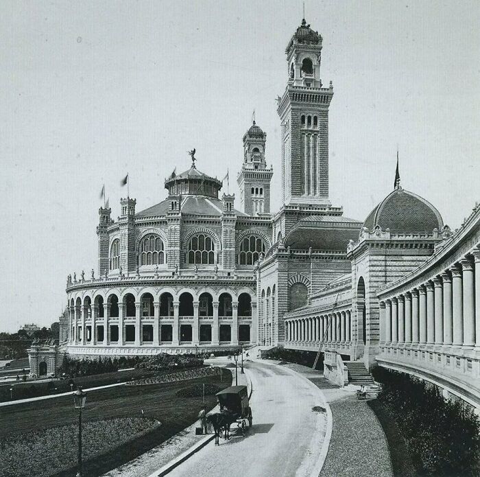Historic American architecture featuring an ornate building with arched windows and a tall tower.