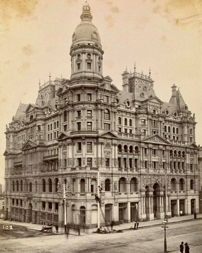 Grand example of old American architecture in an intricate multi-story building with domes and detailed facade.