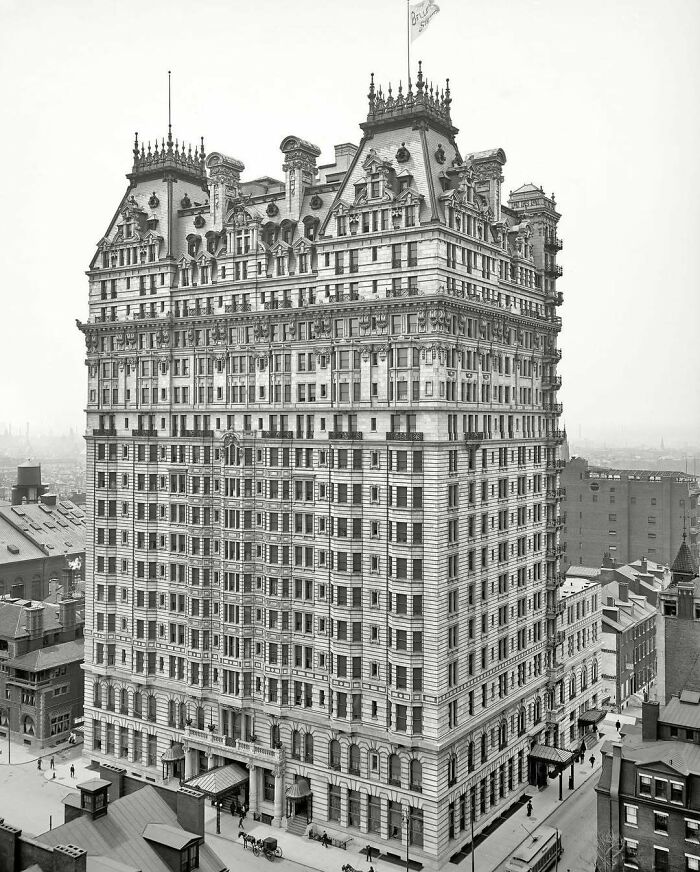 Historic American architecture of a grand, ornate building with intricate details, set in an urban landscape.