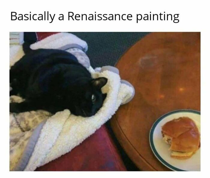 Black cat in play mode, lounging on a blanket, gazes at a sandwich on a table, humorously captioned as a Renaissance painting.