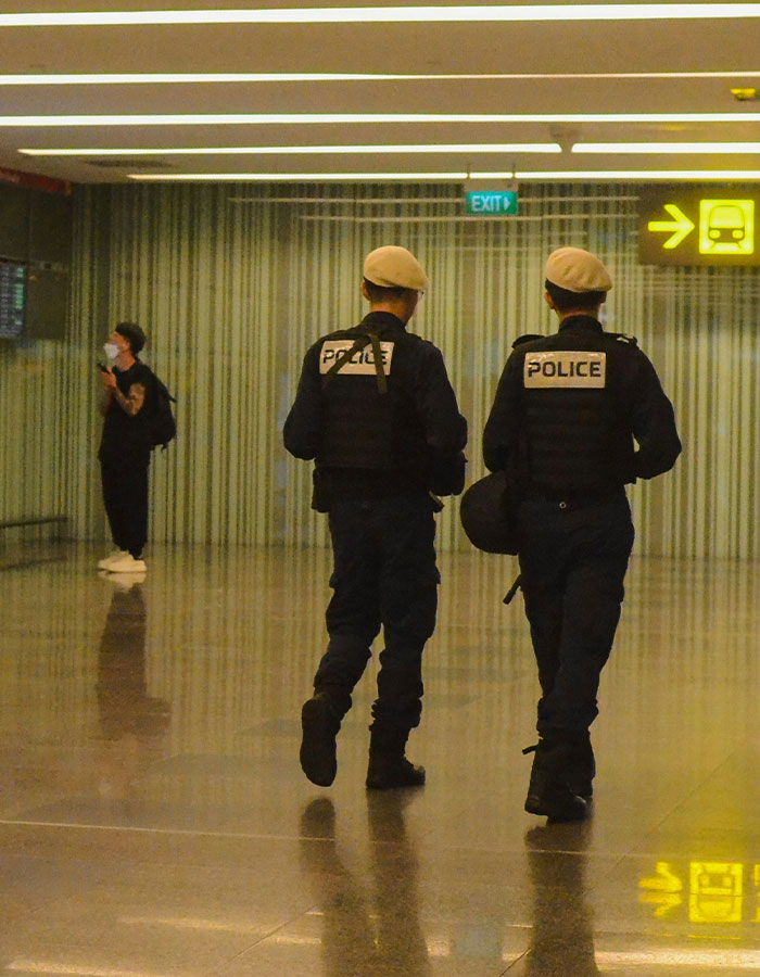 Police officers patrol an airport terminal after denied boarding incident involving a dog. Police officers patrol an airport terminal after denied boarding incident involving a dog.