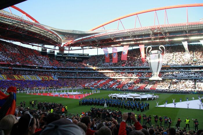 Packed stadium showcasing one of the iconic cathedrals of soccer during a major international tournament opening ceremony.