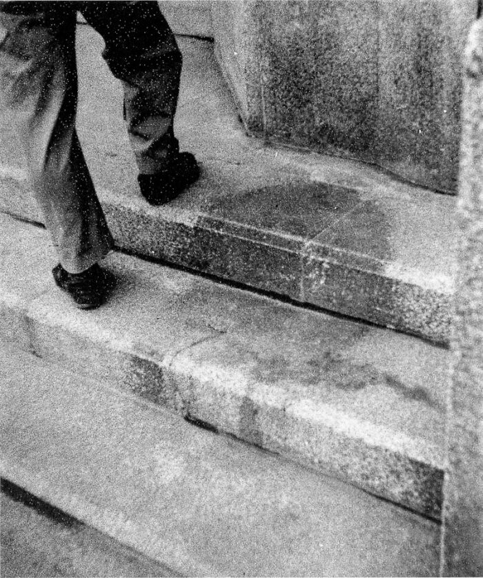 Man's legs on stone steps, hinting at a creepy history. Man's legs on stone steps, hinting at a creepy history.