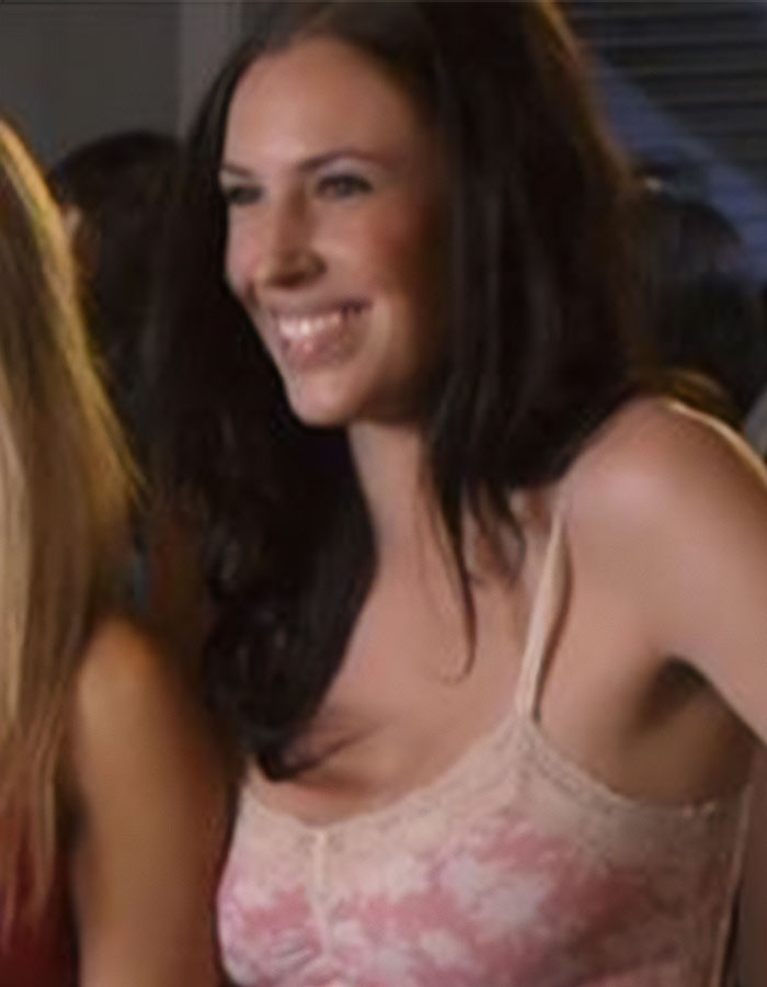 Smiling woman in a pink floral top, related to American Pie star's recent ICE release. Smiling woman in a pink floral top, related to American Pie star's recent ICE release.