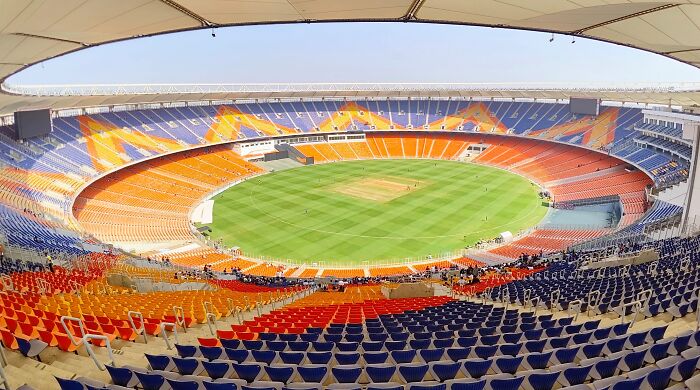 Wide panoramic view of a colorful soccer stadium, one of the iconic cathedrals of soccer where legends are born.