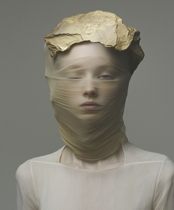 Person with sheer fabric and gold rock headpiece, representing a winning AI image in a competition.
