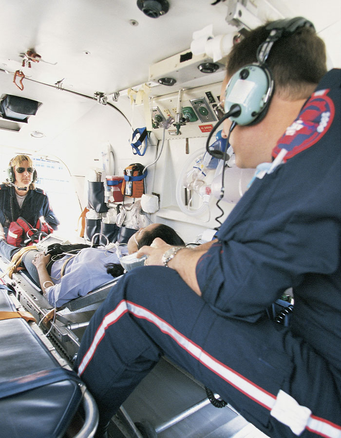 Helicopter paramedics attending to injured person related to model's fall, highlighting family and police disagreement. Helicopter paramedics attending to injured person related to model's fall, highlighting family and police disagreement.