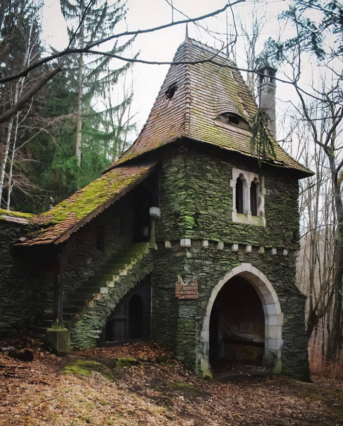 Abandoned building in the woods, covered in moss, showcasing nature's beauty over time.