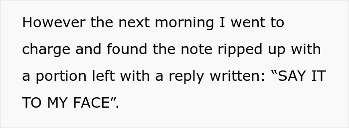 Note at charging station ripped with reply, "SAY IT TO MY FACE," highlighting Tesla driver behavior. Note at charging station ripped with reply, "SAY IT TO MY FACE," highlighting Tesla driver behavior.