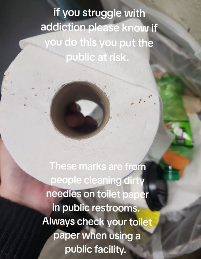 Toilet paper with hidden needle marks warning in public restrooms. Toilet paper with hidden needle marks warning in public restrooms.