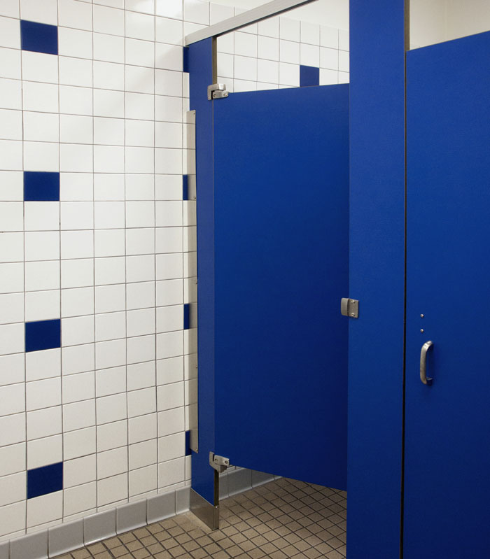 Public restroom with blue stall doors, highlighting concerns about hidden needle marks on toilet paper. Public restroom with blue stall doors, highlighting concerns about hidden needle marks on toilet paper.