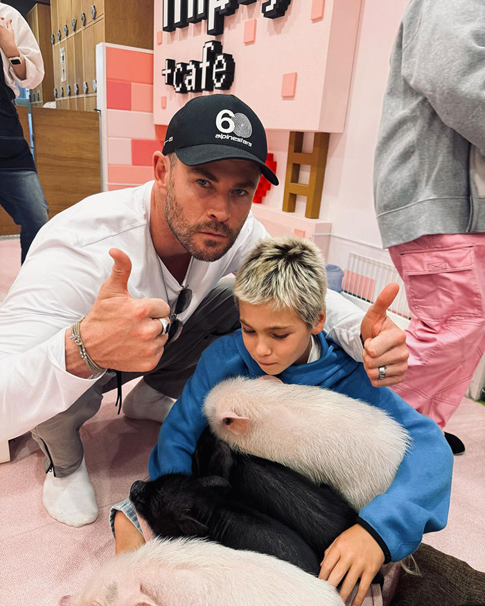Chris Hemsworth with his son and piglets, sparking outrage over an "inappropriate" photo at a cafe. Chris Hemsworth with his son and piglets, sparking outrage over an "inappropriate" photo at a cafe.