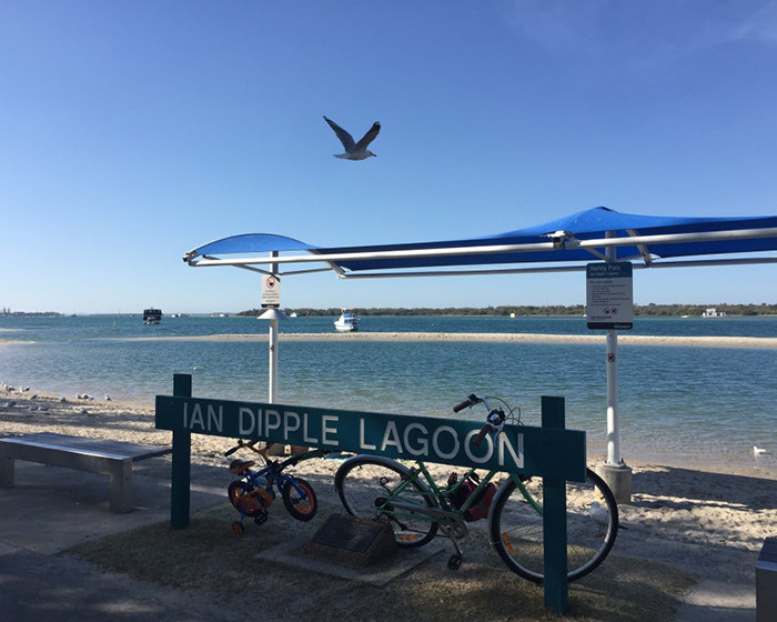 Ian Dipple Lagoon view with bicycles and blue sky. Ian Dipple Lagoon view with bicycles and blue sky.