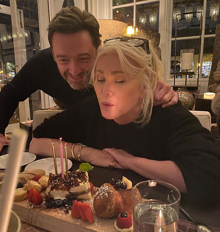 Man and woman at dinner, with candles and dessert, linked to Hugh Jackman and Deborra-Lee Furness' divorce discussion. Man and woman at dinner, with candles and dessert, linked to Hugh Jackman and Deborra-Lee Furness' divorce discussion.