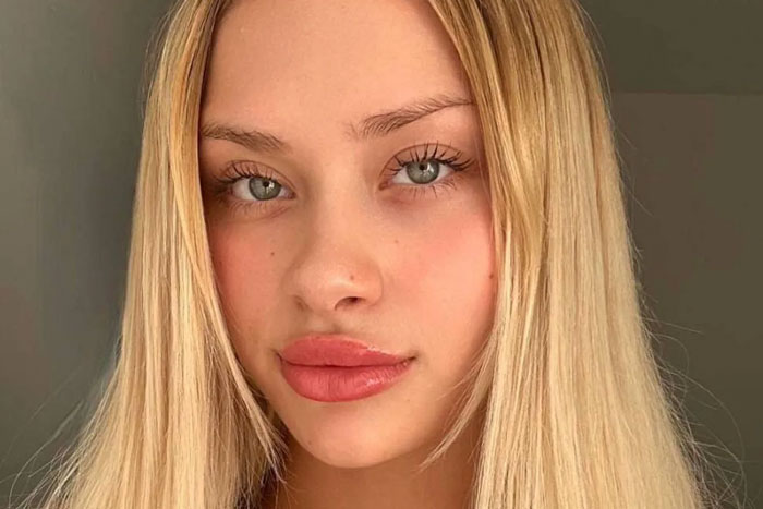 Blonde model with blue eyes, looking directly at the camera, neutral expression. Blonde model with blue eyes, looking directly at the camera, neutral expression.