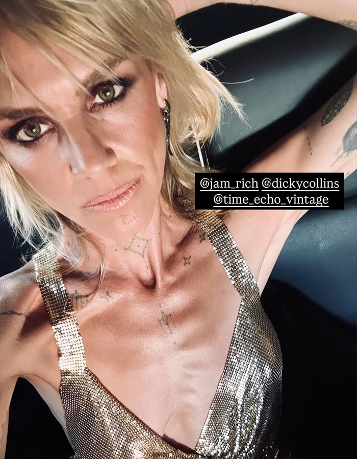 Scrubs star in gold top with tattoos, sparking fans' concern over post-divorce appearance. Scrubs star in gold top with tattoos, sparking fans' concern over post-divorce appearance.