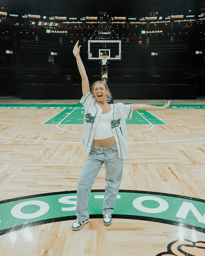 Woman on basketball court, wearing casual outfit, sparking debate on hottest outfit choice. Woman on basketball court, wearing casual outfit, sparking debate on hottest outfit choice.
