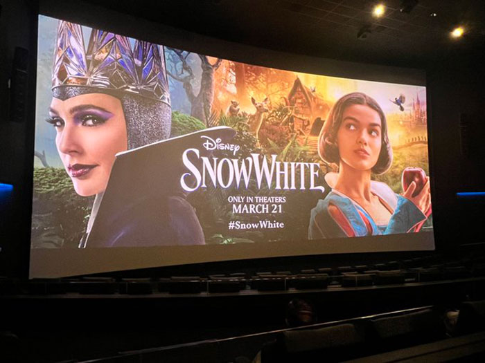 Empty theater showing 'Snow White' poster, highlighting primetime slot and few attendees. Empty theater showing 'Snow White' poster, highlighting primetime slot and few attendees.