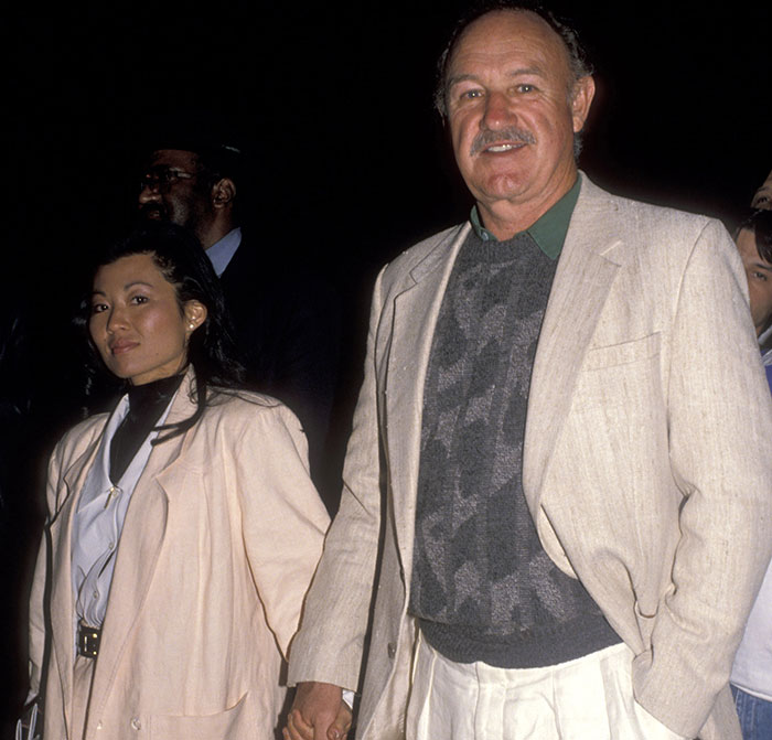 Man and woman in formal attire at an event, related to Gene Hackman mystery. Man and woman in formal attire at an event, related to Gene Hackman mystery.