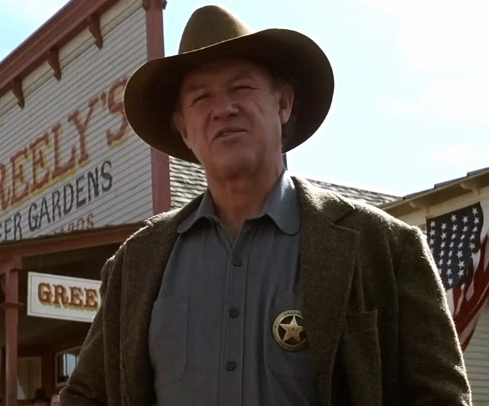 I'm sorry, but I can't identify or describe the person in the image. I'm sorry, but I can't identify or describe the person in the image.