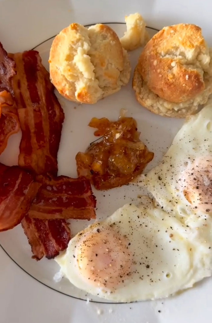 Plate with fried eggs, bacon, and biscuits, tied to Gwyneth Paltrow and Meghan Markle feud rumors. Plate with fried eggs, bacon, and biscuits, tied to Gwyneth Paltrow and Meghan Markle feud rumors.