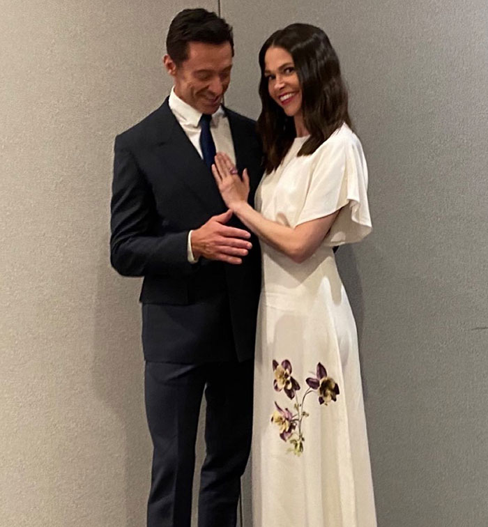 Couple dressed formally, smiling in a gently lit room, symbolizing unity amidst divorce challenges. Couple dressed formally, smiling in a gently lit room, symbolizing unity amidst divorce challenges.