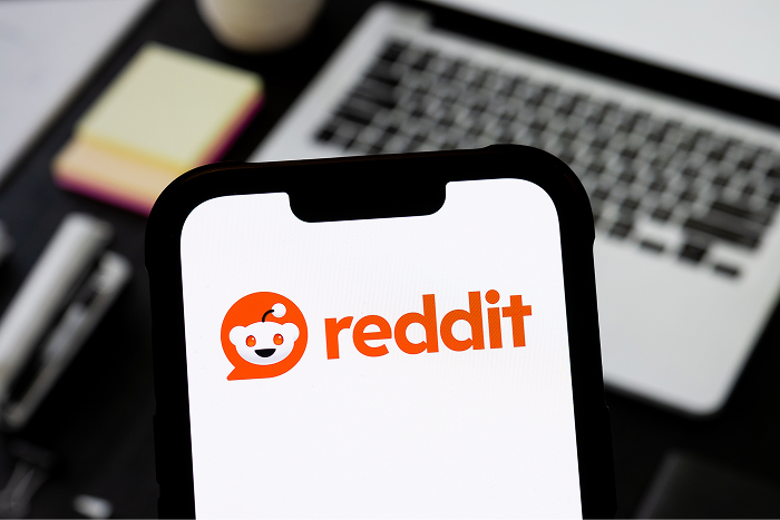 Smartphone displaying Reddit app logo, symbolizing online communities and discussions about Snoop Dogg’s net worth. Smartphone displaying Reddit app logo, symbolizing online communities and discussions about Snoop Dogg’s net worth.