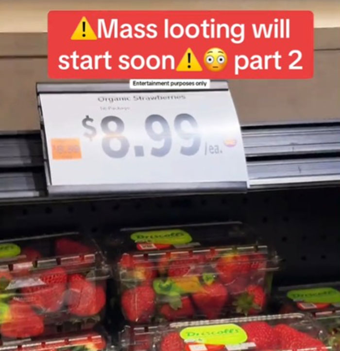 Price tag showing $8.99 for organic strawberries in the US grocery store, sparking outrage over high prices. Price tag showing $8.99 for organic strawberries in the US grocery store, sparking outrage over high prices.
