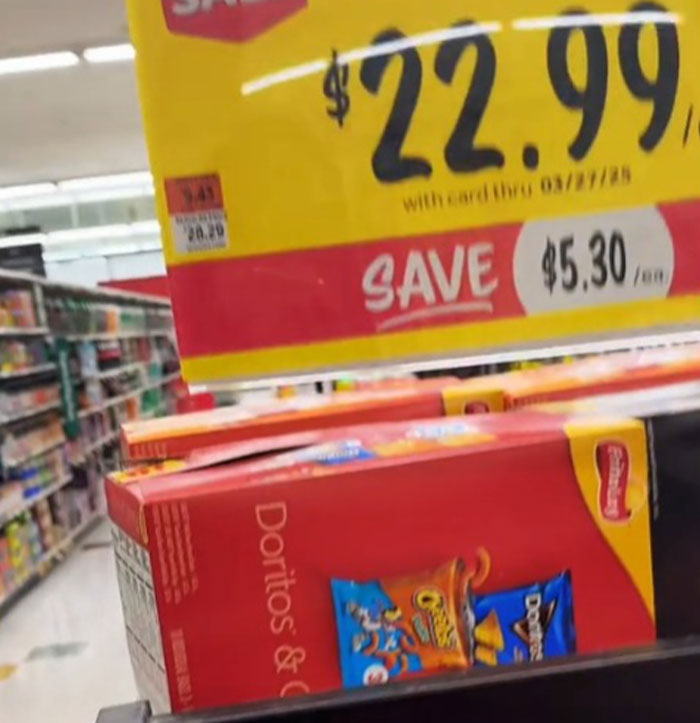 High grocery prices in America: a pack of Doritos priced at $22.99, with a $5.30 discount highlighted.
