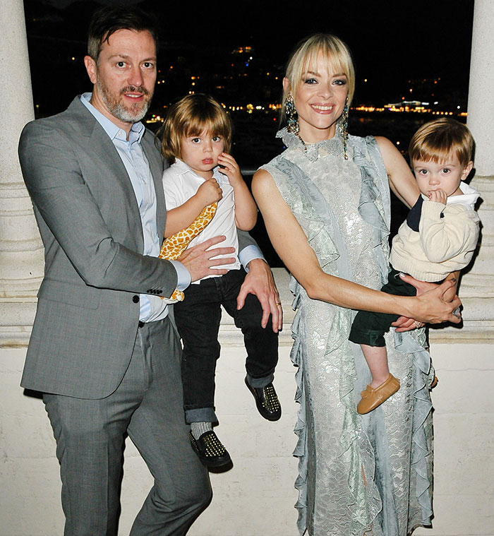 Jaime King with family, posing for a photo at a formal event in elegant attire. Jaime King with family, posing for a photo at a formal event in elegant attire.