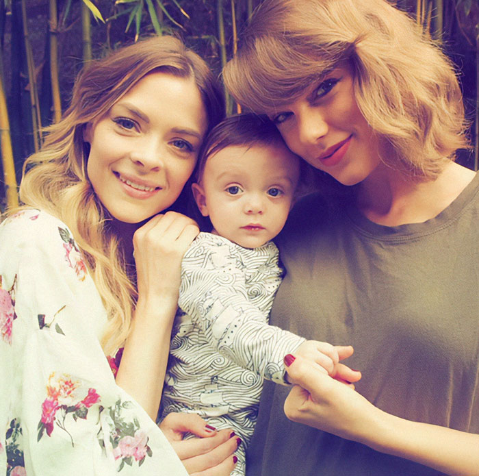 Group photo of two women with a child, focusing on Taylor Swift's godson. Group photo of two women with a child, focusing on Taylor Swift's godson.