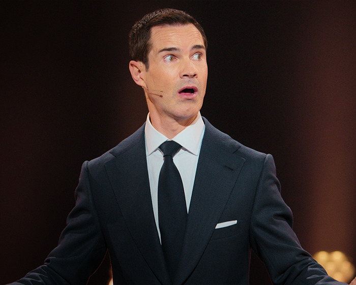 A surprised man in a suit on stage, illustrating cosmetic "tweakments" concept. A surprised man in a suit on stage, illustrating cosmetic "tweakments" concept.