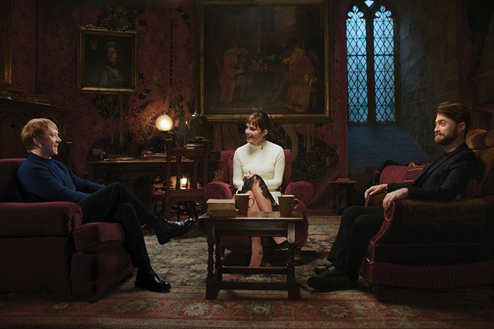 Three actors sit in an ornate room, surrounded by vintage decor, engaged in a discussion about the Harry Potter movies. Three actors sit in an ornate room, surrounded by vintage decor, engaged in a discussion about the Harry Potter movies.