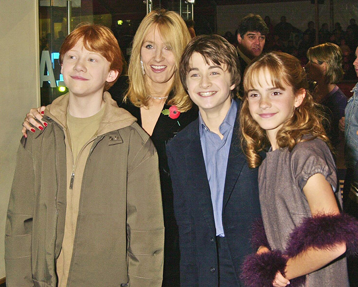 Author with 'Harry Potter' stars, smiling at an event, creating buzz online. Author with 'Harry Potter' stars, smiling at an event, creating buzz online.