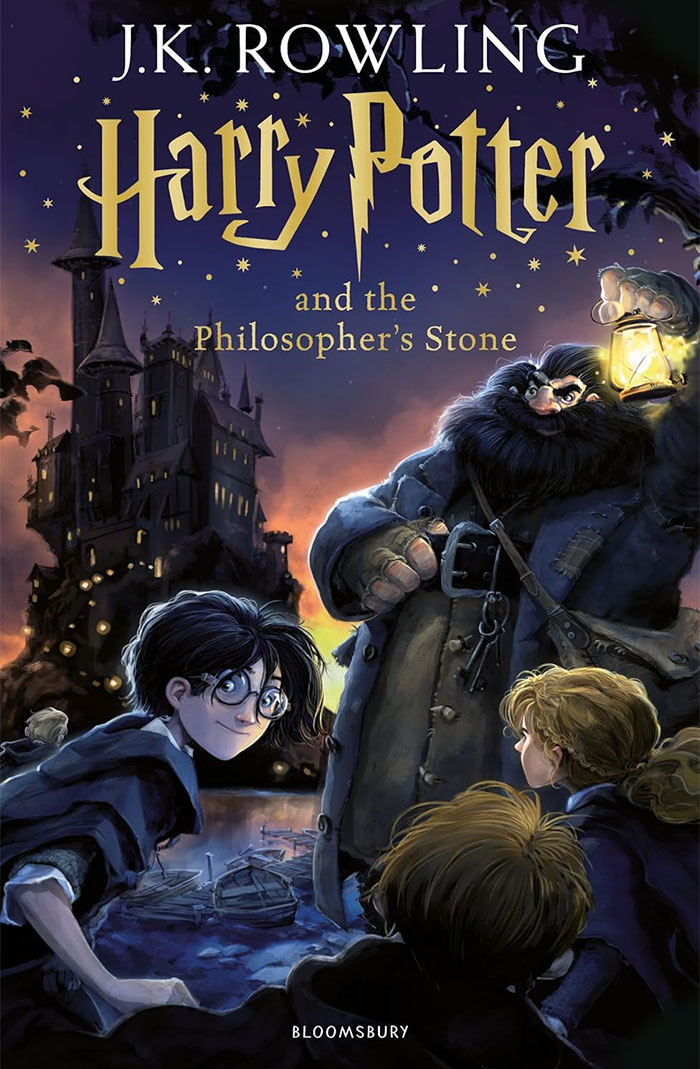 Cover of J.K. Rowling's Harry Potter and the Philosopher's Stone featuring main characters and a castle. Cover of J.K. Rowling's Harry Potter and the Philosopher's Stone featuring main characters and a castle.