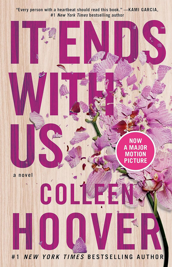 Cover of “It Ends with Us” by Colleen Hoover, featuring pink flowers, related to books people judge. Cover of “It Ends with Us” by Colleen Hoover, featuring pink flowers, related to books people judge.