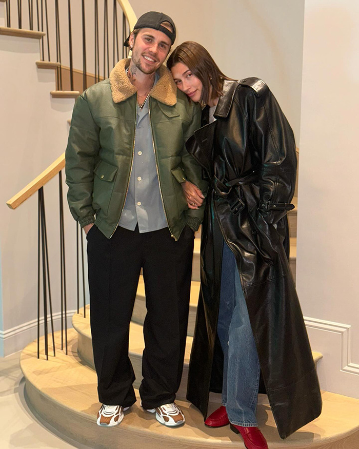 Justin Bieber and Hailey Bieber posing for a photo indoors. Justin Bieber and Hailey Bieber posing for a photo indoors.